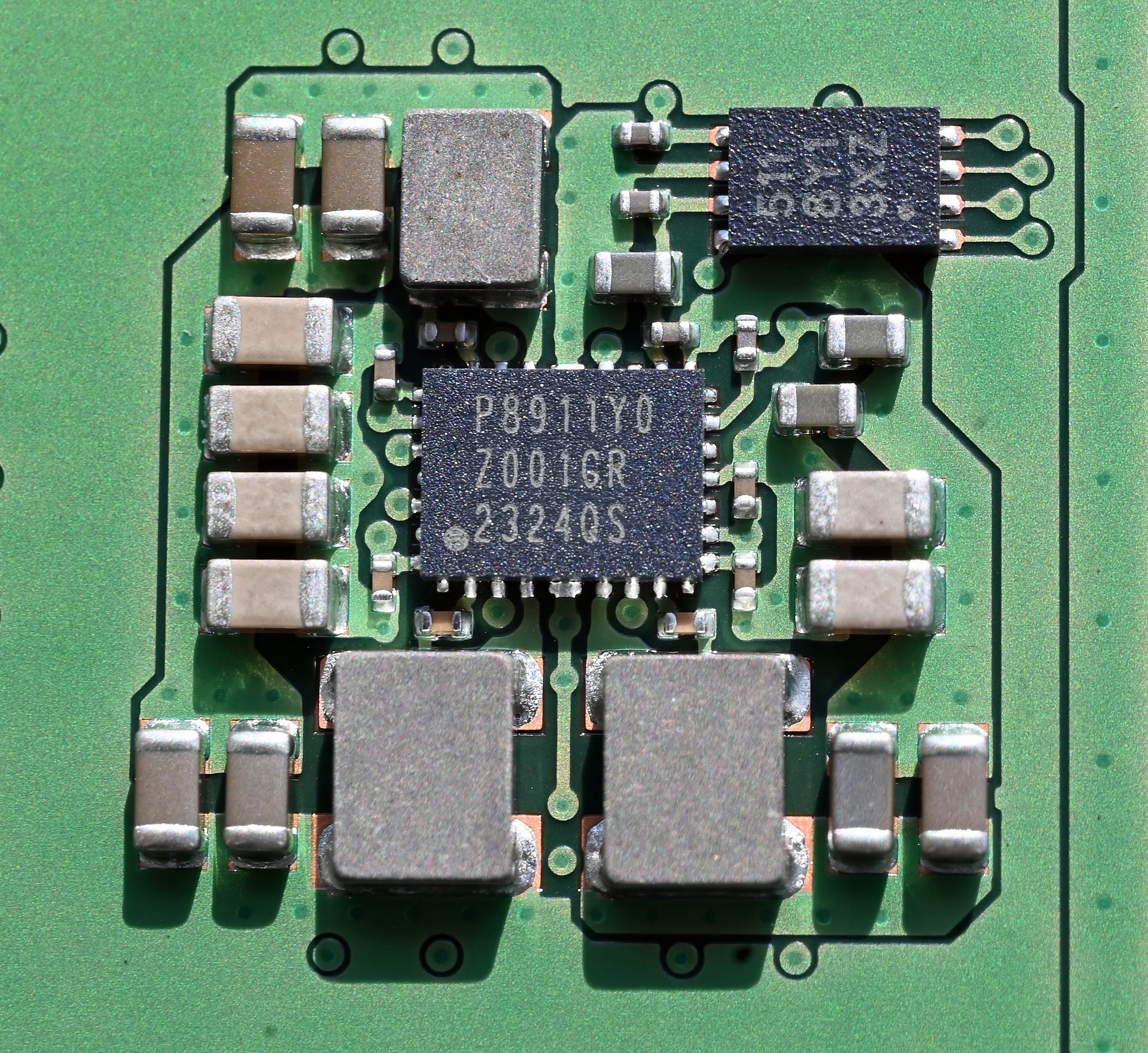 A representative PMIC chip in QFN package — same package class as the AXP2101 (4×4 mm QFN-40, 0.4 mm pitch). The PicoCalc's U3 is the same general type, oriented near the cell connector on the carr…