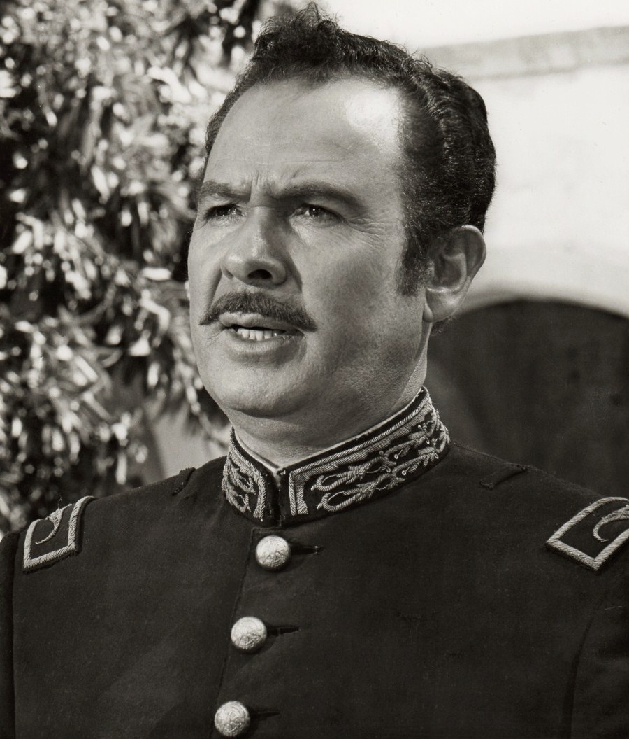 Figure 5.2 — Antonio Aguilar in The Undefeated (1969). The Western genre supplied the visual vocabulary of hat-as-moral-marker that security culture would inherit decades later. By the time the met…