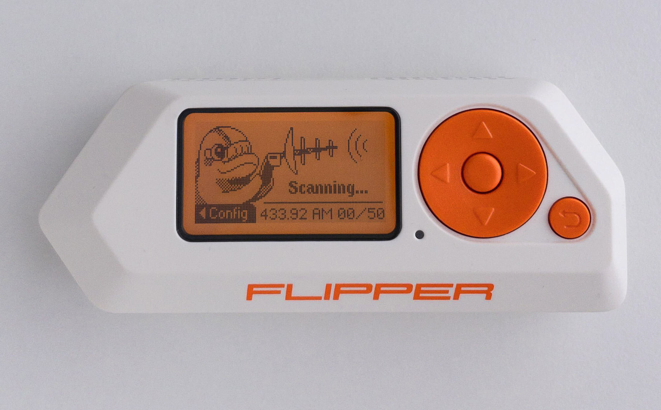 A Flipper Zero running its built-in sub-GHz scanner. The signal shown is a 433 MHz capture in AM modulation — the protocol-decoder library identifies most consumer remotes by their RF signature wit…