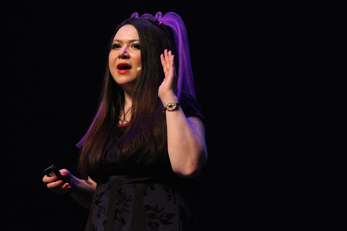 Katie Moussouris presenting at Kiwicon 9 (New Zealand security conference), 2015. Moussouris is the canonical figure for the institutionalization of bug-bounty programs at scale — she built Microso…