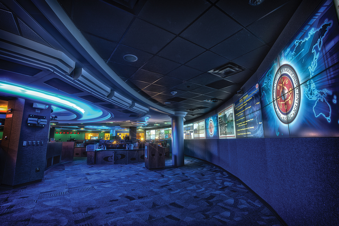 National Security Operations Center floor, 2012. The NSA's NSOC is the canonical "what does a SOC look like" reference photo — multi-station analyst floor, multi-screen workstations, large overhead…